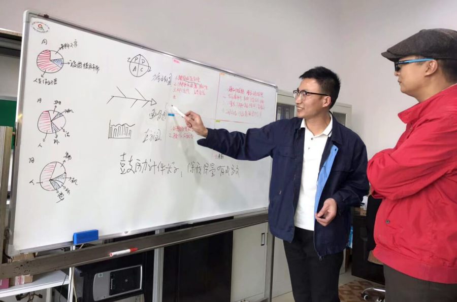 Colleagues discussing quality control