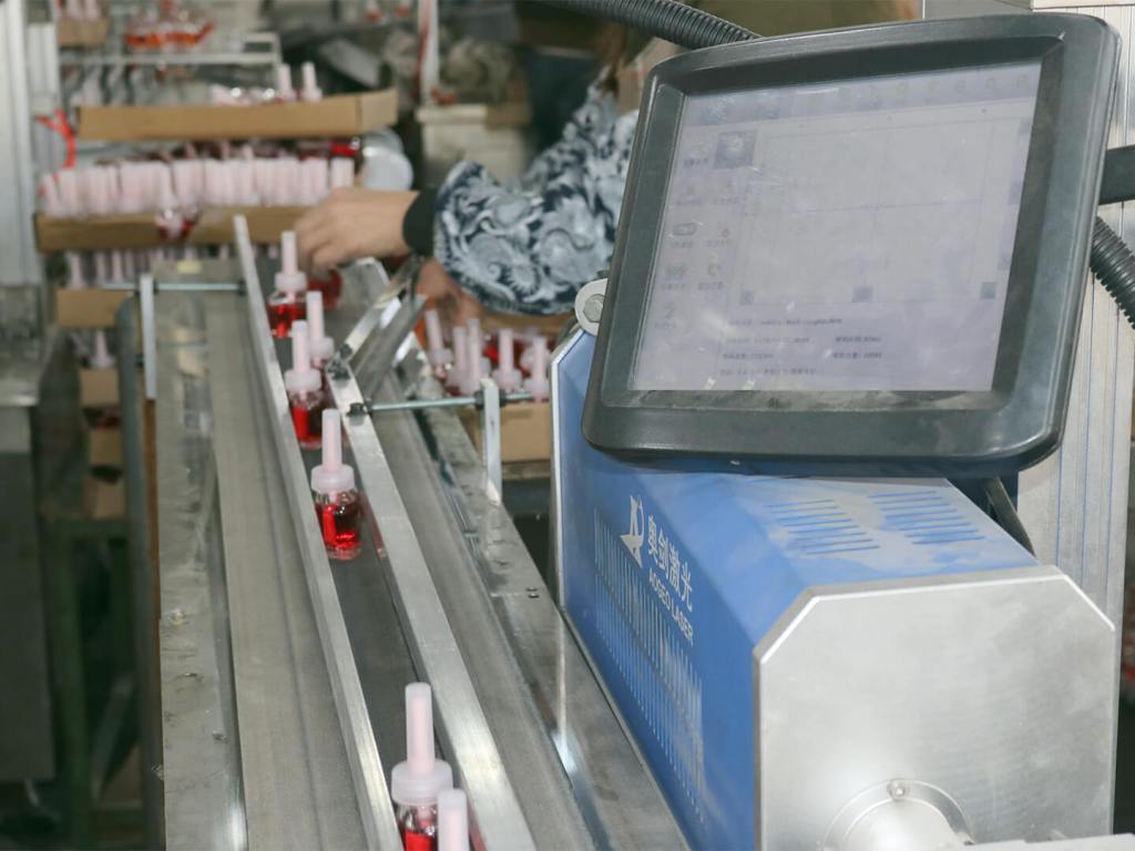 Filled bottles are machine-counted on the way to packaging section